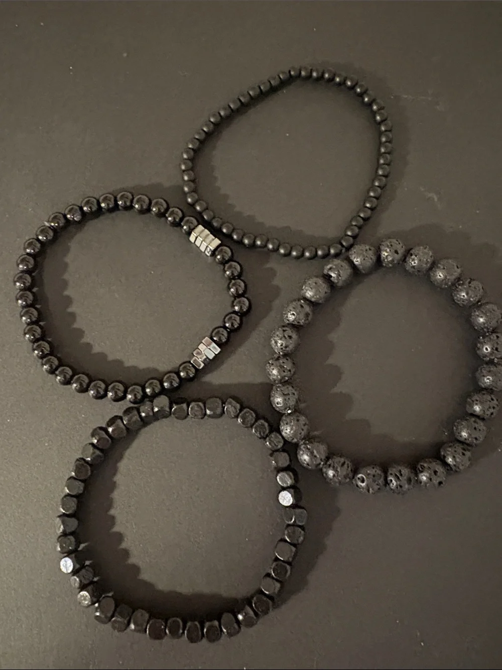 Set of four Black lava stone and plastic NWOT